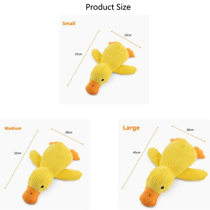 Hot dog sleeping with duck toys to relieve boredom